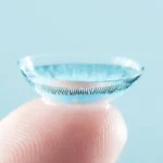 Contact lenses in the hand of a lady from an optical shop in Qatar.